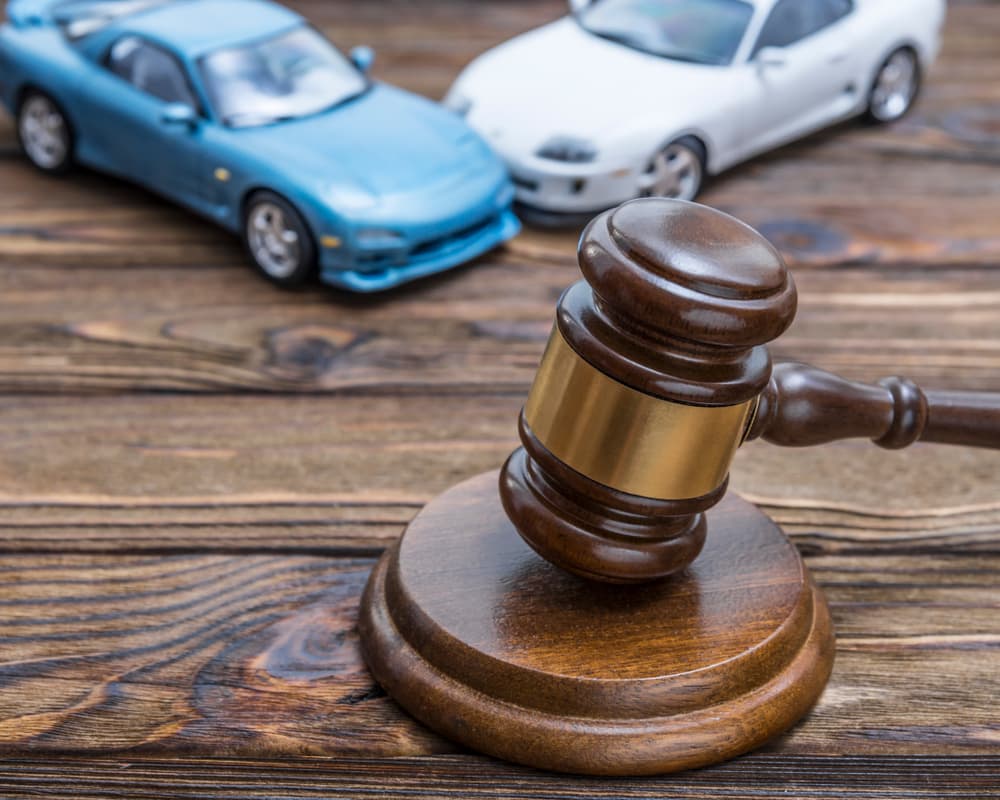 In the aftermath of a road traffic accident involving two cars, both parties are now facing the legal consequences. The gavel of the judge will soon decide the outcomes of this unfortunate incident.